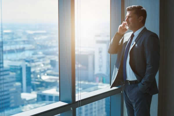 Sales person on phone call looking out of window
