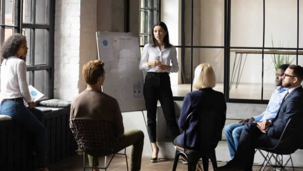 Female employee presenting to team
