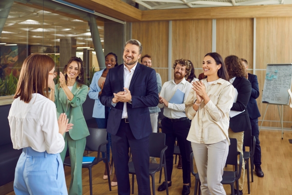 Trainer delivering learning session to employees in a global organisation
